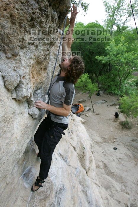 Andrew Dreher top rope climbing Diving for Rocks (5.10d), photographed from  the third bolt of Magster (5.10a).  It was another long day of rock climbing at Seismic Wall on Austin's Barton Creek Greenbelt, Saturday, April 11, 2009.

Filename: SRM_20090411_16423893.JPG
Aperture: f/5.6
Shutter Speed: 1/320
Body: Canon EOS-1D Mark II
Lens: Canon EF 16-35mm f/2.8 L