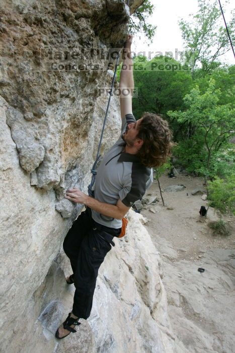 Andrew Dreher top rope climbing Diving for Rocks (5.10d), photographed from  the third bolt of Magster (5.10a).  It was another long day of rock climbing at Seismic Wall on Austin's Barton Creek Greenbelt, Saturday, April 11, 2009.

Filename: SRM_20090411_16423996.JPG
Aperture: f/5.6
Shutter Speed: 1/320
Body: Canon EOS-1D Mark II
Lens: Canon EF 16-35mm f/2.8 L