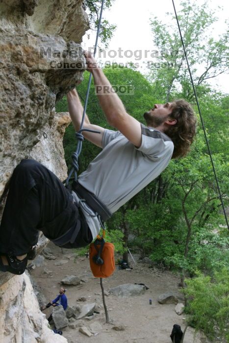 Andrew Dreher top rope climbing Diving for Rocks (5.10d), photographed from  the third bolt of Magster (5.10a).  It was another long day of rock climbing at Seismic Wall on Austin's Barton Creek Greenbelt, Saturday, April 11, 2009.

Filename: SRM_20090411_16424801.JPG
Aperture: f/5.6
Shutter Speed: 1/320
Body: Canon EOS-1D Mark II
Lens: Canon EF 16-35mm f/2.8 L