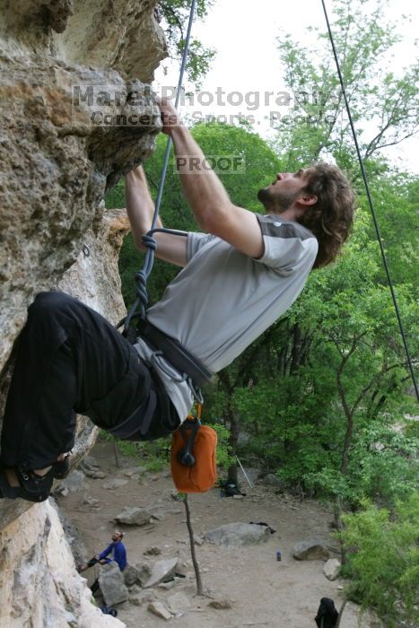 Andrew Dreher top rope climbing Diving for Rocks (5.10d), photographed from  the third bolt of Magster (5.10a).  It was another long day of rock climbing at Seismic Wall on Austin's Barton Creek Greenbelt, Saturday, April 11, 2009.

Filename: SRM_20090411_16424802.JPG
Aperture: f/5.6
Shutter Speed: 1/320
Body: Canon EOS-1D Mark II
Lens: Canon EF 16-35mm f/2.8 L