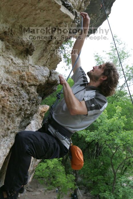 Andrew Dreher top rope climbing Diving for Rocks (5.10d), photographed from  the third bolt of Magster (5.10a).  It was another long day of rock climbing at Seismic Wall on Austin's Barton Creek Greenbelt, Saturday, April 11, 2009.

Filename: SRM_20090411_16424903.JPG
Aperture: f/5.6
Shutter Speed: 1/320
Body: Canon EOS-1D Mark II
Lens: Canon EF 16-35mm f/2.8 L