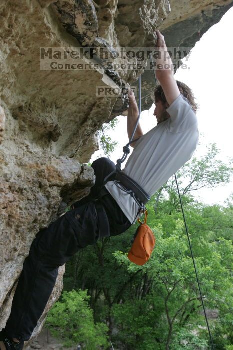 Andrew Dreher top rope climbing Diving for Rocks (5.10d), photographed from  the third bolt of Magster (5.10a).  It was another long day of rock climbing at Seismic Wall on Austin's Barton Creek Greenbelt, Saturday, April 11, 2009.

Filename: SRM_20090411_16425508.JPG
Aperture: f/5.6
Shutter Speed: 1/320
Body: Canon EOS-1D Mark II
Lens: Canon EF 16-35mm f/2.8 L