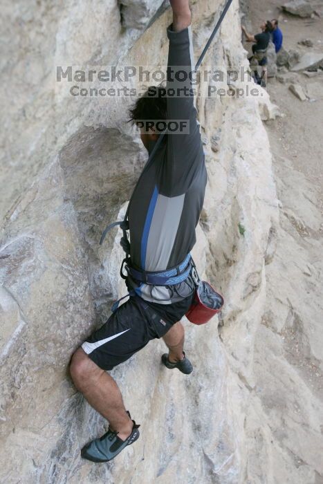 Javier Morales top rope climbing Diving for Rocks (5.10d), photographed from  the third bolt of Magster (5.10a).  It was another long day of rock climbing at Seismic Wall on Austin's Barton Creek Greenbelt, Saturday, April 11, 2009.

Filename: SRM_20090411_16482319.JPG
Aperture: f/5.6
Shutter Speed: 1/320
Body: Canon EOS-1D Mark II
Lens: Canon EF 16-35mm f/2.8 L