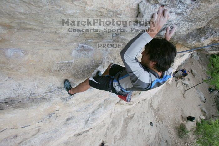 Javier Morales top rope climbing Diving for Rocks (5.10d), photographed from  the third bolt of Magster (5.10a).  It was another long day of rock climbing at Seismic Wall on Austin's Barton Creek Greenbelt, Saturday, April 11, 2009.

Filename: SRM_20090411_16484928.JPG
Aperture: f/5.6
Shutter Speed: 1/320
Body: Canon EOS-1D Mark II
Lens: Canon EF 16-35mm f/2.8 L