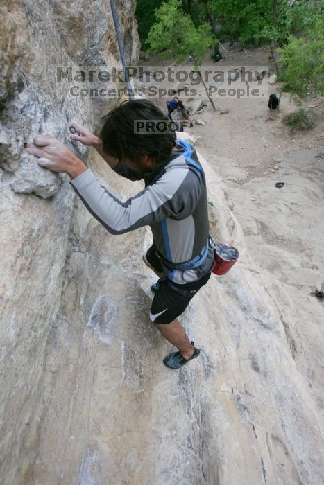 Javier Morales top rope climbing Diving for Rocks (5.10d), photographed from  the third bolt of Magster (5.10a).  It was another long day of rock climbing at Seismic Wall on Austin's Barton Creek Greenbelt, Saturday, April 11, 2009.

Filename: SRM_20090411_16485030.JPG
Aperture: f/5.6
Shutter Speed: 1/320
Body: Canon EOS-1D Mark II
Lens: Canon EF 16-35mm f/2.8 L