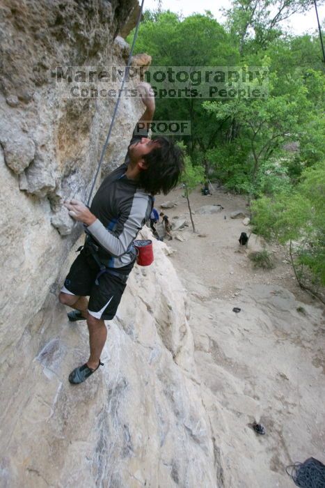 Javier Morales top rope climbing Diving for Rocks (5.10d), photographed from  the third bolt of Magster (5.10a).  It was another long day of rock climbing at Seismic Wall on Austin's Barton Creek Greenbelt, Saturday, April 11, 2009.

Filename: SRM_20090411_16485336.JPG
Aperture: f/5.6
Shutter Speed: 1/320
Body: Canon EOS-1D Mark II
Lens: Canon EF 16-35mm f/2.8 L