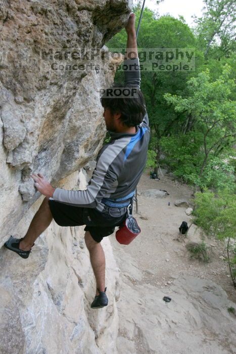 Javier Morales top rope climbing Diving for Rocks (5.10d), photographed from  the third bolt of Magster (5.10a).  It was another long day of rock climbing at Seismic Wall on Austin's Barton Creek Greenbelt, Saturday, April 11, 2009.

Filename: SRM_20090411_16491659.JPG
Aperture: f/5.6
Shutter Speed: 1/320
Body: Canon EOS-1D Mark II
Lens: Canon EF 16-35mm f/2.8 L