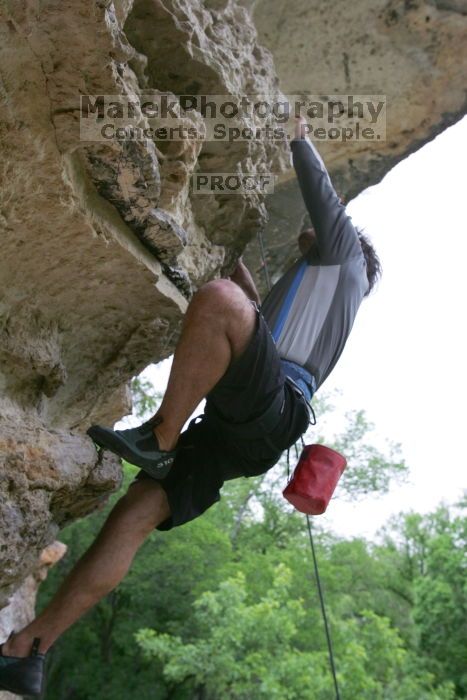 Javier Morales top rope climbing Diving for Rocks (5.10d), photographed from  the third bolt of Magster (5.10a).  It was another long day of rock climbing at Seismic Wall on Austin's Barton Creek Greenbelt, Saturday, April 11, 2009.

Filename: SRM_20090411_16493667.JPG
Aperture: f/5.6
Shutter Speed: 1/320
Body: Canon EOS-1D Mark II
Lens: Canon EF 16-35mm f/2.8 L