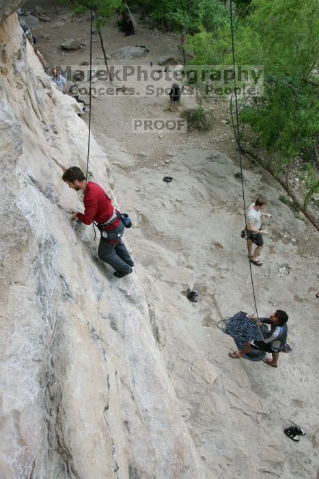 Me top rope climbing Diving for Rocks (5.10d) with Javier Morales belaying, photographed from  the third bolt of Magster (5.10a) by Andrew Dreher.  It was another long day of rock climbing at Seismic Wall on Austin's Barton Creek Greenbelt, Saturday, April 11, 2009.

Filename: SRM_20090411_17024470.JPG
Aperture: f/5.6
Shutter Speed: 1/250
Body: Canon EOS-1D Mark II
Lens: Canon EF 16-35mm f/2.8 L