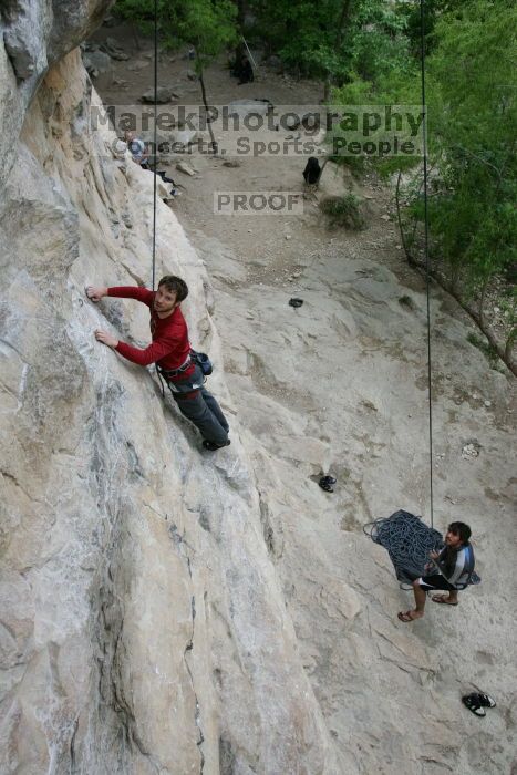 Me top rope climbing Diving for Rocks (5.10d) with Javier Morales belaying, photographed from  the third bolt of Magster (5.10a) by Andrew Dreher.  It was another long day of rock climbing at Seismic Wall on Austin's Barton Creek Greenbelt, Saturday, April 11, 2009.

Filename: SRM_20090411_17031173.JPG
Aperture: f/5.6
Shutter Speed: 1/320
Body: Canon EOS-1D Mark II
Lens: Canon EF 16-35mm f/2.8 L