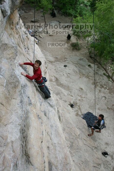 Me top rope climbing Diving for Rocks (5.10d) with Javier Morales belaying, photographed from  the third bolt of Magster (5.10a) by Andrew Dreher.  It was another long day of rock climbing at Seismic Wall on Austin's Barton Creek Greenbelt, Saturday, April 11, 2009.

Filename: SRM_20090411_17031174.JPG
Aperture: f/5.6
Shutter Speed: 1/320
Body: Canon EOS-1D Mark II
Lens: Canon EF 16-35mm f/2.8 L