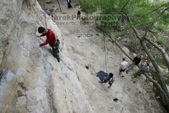 Me top rope climbing Diving for Rocks (5.10d) with Javier Morales belaying, photographed from  the third bolt of Magster (5.10a) by Andrew Dreher.  It was another long day of rock climbing at Seismic Wall on Austin's Barton Creek Greenbelt, Saturday, April 11, 2009.

Filename: SRM_20090411_17033675.JPG
Aperture: f/5.6
Shutter Speed: 1/320
Body: Canon EOS-1D Mark II
Lens: Canon EF 16-35mm f/2.8 L