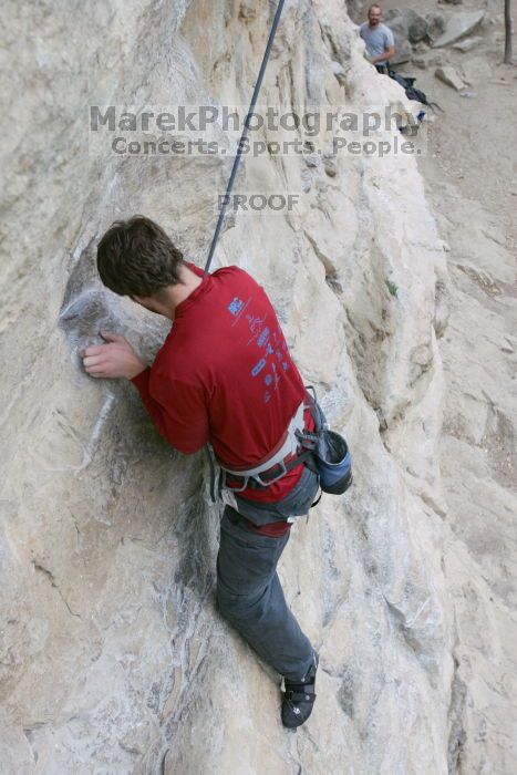 Me top rope climbing Diving for Rocks (5.10d), photographed from  the third bolt of Magster (5.10a) by Andrew Dreher.  It was another long day of rock climbing at Seismic Wall on Austin's Barton Creek Greenbelt, Saturday, April 11, 2009.

Filename: SRM_20090411_17041078.JPG
Aperture: f/5.6
Shutter Speed: 1/320
Body: Canon EOS-1D Mark II
Lens: Canon EF 16-35mm f/2.8 L