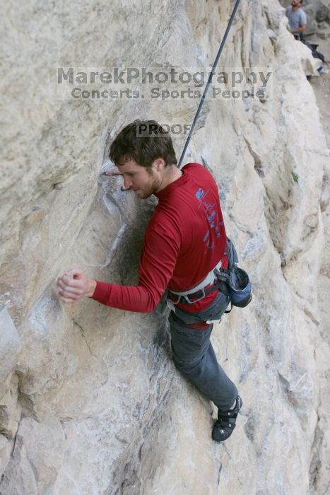 Me top rope climbing Diving for Rocks (5.10d), photographed from  the third bolt of Magster (5.10a) by Andrew Dreher.  It was another long day of rock climbing at Seismic Wall on Austin's Barton Creek Greenbelt, Saturday, April 11, 2009.

Filename: SRM_20090411_17041579.JPG
Aperture: f/5.6
Shutter Speed: 1/320
Body: Canon EOS-1D Mark II
Lens: Canon EF 16-35mm f/2.8 L