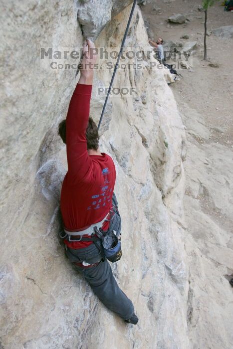 Me top rope climbing Diving for Rocks (5.10d), photographed from  the third bolt of Magster (5.10a) by Andrew Dreher.  It was another long day of rock climbing at Seismic Wall on Austin's Barton Creek Greenbelt, Saturday, April 11, 2009.

Filename: SRM_20090411_17042782.JPG
Aperture: f/5.6
Shutter Speed: 1/320
Body: Canon EOS-1D Mark II
Lens: Canon EF 16-35mm f/2.8 L