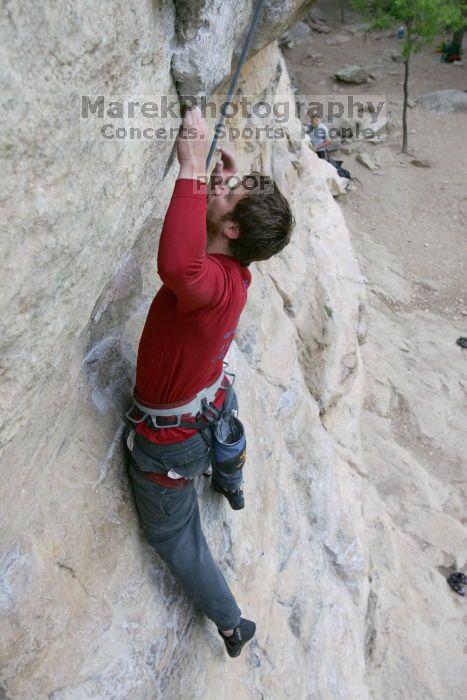 Me top rope climbing Diving for Rocks (5.10d), photographed from  the third bolt of Magster (5.10a) by Andrew Dreher.  It was another long day of rock climbing at Seismic Wall on Austin's Barton Creek Greenbelt, Saturday, April 11, 2009.

Filename: SRM_20090411_17043183.JPG
Aperture: f/5.6
Shutter Speed: 1/320
Body: Canon EOS-1D Mark II
Lens: Canon EF 16-35mm f/2.8 L