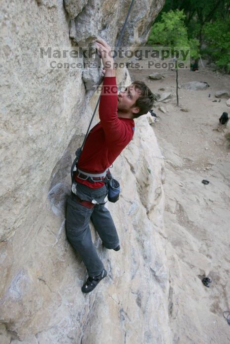 Me top rope climbing Diving for Rocks (5.10d), photographed from  the third bolt of Magster (5.10a) by Andrew Dreher.  It was another long day of rock climbing at Seismic Wall on Austin's Barton Creek Greenbelt, Saturday, April 11, 2009.

Filename: SRM_20090411_17043484.JPG
Aperture: f/5.6
Shutter Speed: 1/320
Body: Canon EOS-1D Mark II
Lens: Canon EF 16-35mm f/2.8 L