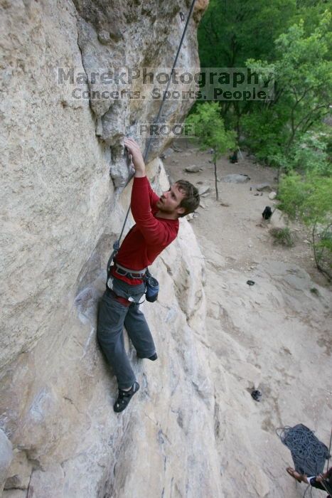 Me top rope climbing Diving for Rocks (5.10d), photographed from  the third bolt of Magster (5.10a) by Andrew Dreher.  It was another long day of rock climbing at Seismic Wall on Austin's Barton Creek Greenbelt, Saturday, April 11, 2009.

Filename: SRM_20090411_17043986.JPG
Aperture: f/5.6
Shutter Speed: 1/320
Body: Canon EOS-1D Mark II
Lens: Canon EF 16-35mm f/2.8 L