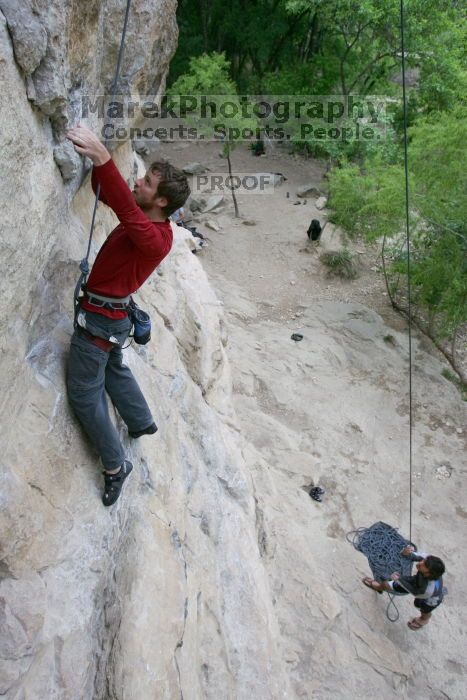 Me top rope climbing Diving for Rocks (5.10d) with Javier Morales belaying, photographed from  the third bolt of Magster (5.10a) by Andrew Dreher.  It was another long day of rock climbing at Seismic Wall on Austin's Barton Creek Greenbelt, Saturday, April 11, 2009.

Filename: SRM_20090411_17044888.JPG
Aperture: f/5.6
Shutter Speed: 1/320
Body: Canon EOS-1D Mark II
Lens: Canon EF 16-35mm f/2.8 L