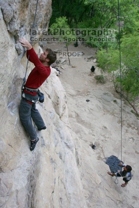 Me top rope climbing Diving for Rocks (5.10d) with Javier Morales belaying, photographed from  the third bolt of Magster (5.10a) by Andrew Dreher.  It was another long day of rock climbing at Seismic Wall on Austin's Barton Creek Greenbelt, Saturday, April 11, 2009.

Filename: SRM_20090411_17044889.JPG
Aperture: f/5.6
Shutter Speed: 1/320
Body: Canon EOS-1D Mark II
Lens: Canon EF 16-35mm f/2.8 L