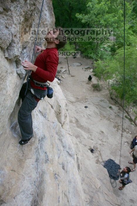 Me top rope climbing Diving for Rocks (5.10d) with Javier Morales belaying, photographed from  the third bolt of Magster (5.10a) by Andrew Dreher.  It was another long day of rock climbing at Seismic Wall on Austin's Barton Creek Greenbelt, Saturday, April 11, 2009.

Filename: SRM_20090411_17051092.JPG
Aperture: f/5.6
Shutter Speed: 1/320
Body: Canon EOS-1D Mark II
Lens: Canon EF 16-35mm f/2.8 L