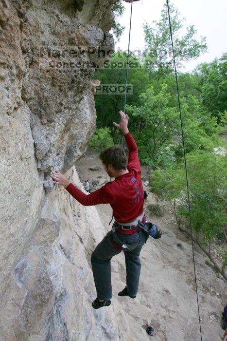 Me top rope climbing Diving for Rocks (5.10d), photographed from  the third bolt of Magster (5.10a) by Andrew Dreher.  It was another long day of rock climbing at Seismic Wall on Austin's Barton Creek Greenbelt, Saturday, April 11, 2009.

Filename: SRM_20090411_17051100.JPG
Aperture: f/5.6
Shutter Speed: 1/320
Body: Canon EOS-1D Mark II
Lens: Canon EF 16-35mm f/2.8 L