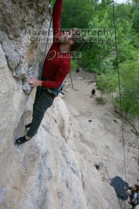 Me top rope climbing Diving for Rocks (5.10d) with Javier Morales belaying, photographed from  the third bolt of Magster (5.10a) by Andrew Dreher.  It was another long day of rock climbing at Seismic Wall on Austin's Barton Creek Greenbelt, Saturday, April 11, 2009.

Filename: SRM_20090411_17051194.JPG
Aperture: f/5.6
Shutter Speed: 1/320
Body: Canon EOS-1D Mark II
Lens: Canon EF 16-35mm f/2.8 L