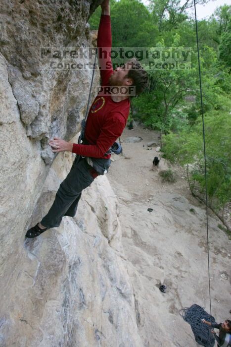 Me top rope climbing Diving for Rocks (5.10d) with Javier Morales belaying, photographed from  the third bolt of Magster (5.10a) by Andrew Dreher.  It was another long day of rock climbing at Seismic Wall on Austin's Barton Creek Greenbelt, Saturday, April 11, 2009.

Filename: SRM_20090411_17051195.JPG
Aperture: f/5.6
Shutter Speed: 1/320
Body: Canon EOS-1D Mark II
Lens: Canon EF 16-35mm f/2.8 L