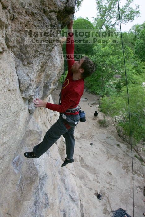 Me top rope climbing Diving for Rocks (5.10d), photographed from  the third bolt of Magster (5.10a) by Andrew Dreher.  It was another long day of rock climbing at Seismic Wall on Austin's Barton Creek Greenbelt, Saturday, April 11, 2009.

Filename: SRM_20090411_17051197.JPG
Aperture: f/5.6
Shutter Speed: 1/320
Body: Canon EOS-1D Mark II
Lens: Canon EF 16-35mm f/2.8 L