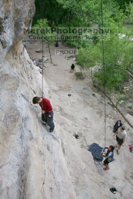 Me top rope climbing Diving for Rocks (5.10d) with Javier Morales belaying, photographed from  the third bolt of Magster (5.10a) by Andrew Dreher.  It was another long day of rock climbing at Seismic Wall on Austin's Barton Creek Greenbelt, Saturday, April 11, 2009.

Filename: SRM_20090411_17063705.JPG
Aperture: f/5.6
Shutter Speed: 1/320
Body: Canon EOS-1D Mark II
Lens: Canon EF 16-35mm f/2.8 L