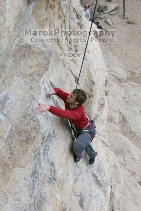 Me top rope climbing Diving for Rocks (5.10d), photographed from  the third bolt of Magster (5.10a) by Andrew Dreher.  It was another long day of rock climbing at Seismic Wall on Austin's Barton Creek Greenbelt, Saturday, April 11, 2009.

Filename: SRM_20090411_17065206.JPG
Aperture: f/5.6
Shutter Speed: 1/320
Body: Canon EOS-1D Mark II
Lens: Canon EF 16-35mm f/2.8 L