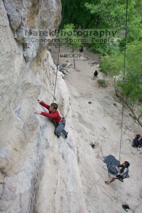 Me top rope climbing Diving for Rocks (5.10d) with Javier Morales belaying, photographed from  the third bolt of Magster (5.10a) by Andrew Dreher.  It was another long day of rock climbing at Seismic Wall on Austin's Barton Creek Greenbelt, Saturday, April 11, 2009.

Filename: SRM_20090411_17065607.JPG
Aperture: f/5.6
Shutter Speed: 1/320
Body: Canon EOS-1D Mark II
Lens: Canon EF 16-35mm f/2.8 L