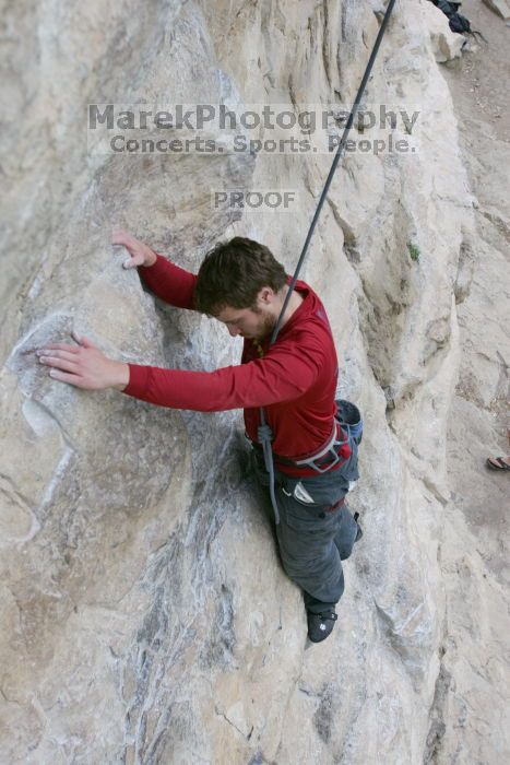 Me top rope climbing Diving for Rocks (5.10d), photographed from  the third bolt of Magster (5.10a) by Andrew Dreher.  It was another long day of rock climbing at Seismic Wall on Austin's Barton Creek Greenbelt, Saturday, April 11, 2009.

Filename: SRM_20090411_17071109.JPG
Aperture: f/5.6
Shutter Speed: 1/320
Body: Canon EOS-1D Mark II
Lens: Canon EF 16-35mm f/2.8 L