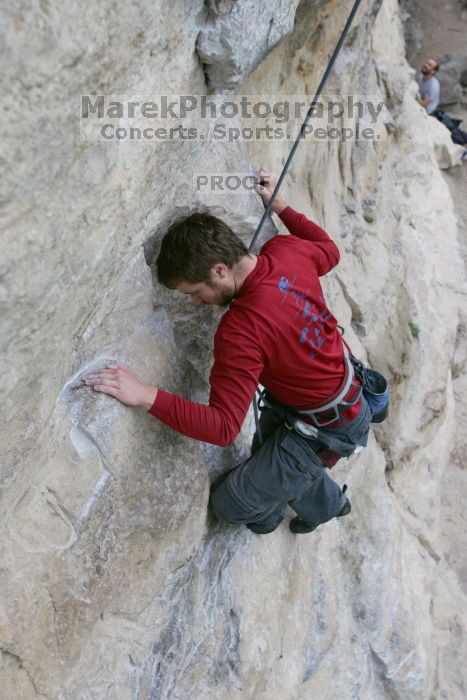 Me top rope climbing Diving for Rocks (5.10d), photographed from  the third bolt of Magster (5.10a) by Andrew Dreher.  It was another long day of rock climbing at Seismic Wall on Austin's Barton Creek Greenbelt, Saturday, April 11, 2009.

Filename: SRM_20090411_17072613.JPG
Aperture: f/5.6
Shutter Speed: 1/320
Body: Canon EOS-1D Mark II
Lens: Canon EF 16-35mm f/2.8 L