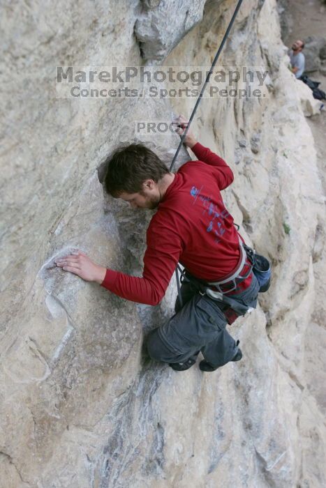 Me top rope climbing Diving for Rocks (5.10d), photographed from  the third bolt of Magster (5.10a) by Andrew Dreher.  It was another long day of rock climbing at Seismic Wall on Austin's Barton Creek Greenbelt, Saturday, April 11, 2009.

Filename: SRM_20090411_17072614.JPG
Aperture: f/5.6
Shutter Speed: 1/320
Body: Canon EOS-1D Mark II
Lens: Canon EF 16-35mm f/2.8 L