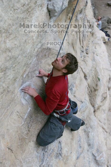 Me top rope climbing Diving for Rocks (5.10d), photographed from  the third bolt of Magster (5.10a) by Andrew Dreher.  It was another long day of rock climbing at Seismic Wall on Austin's Barton Creek Greenbelt, Saturday, April 11, 2009.

Filename: SRM_20090411_17073015.JPG
Aperture: f/5.6
Shutter Speed: 1/320
Body: Canon EOS-1D Mark II
Lens: Canon EF 16-35mm f/2.8 L