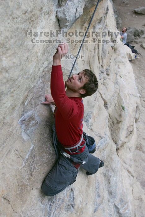 Me top rope climbing Diving for Rocks (5.10d), photographed from  the third bolt of Magster (5.10a) by Andrew Dreher.  It was another long day of rock climbing at Seismic Wall on Austin's Barton Creek Greenbelt, Saturday, April 11, 2009.

Filename: SRM_20090411_17073116.JPG
Aperture: f/5.6
Shutter Speed: 1/320
Body: Canon EOS-1D Mark II
Lens: Canon EF 16-35mm f/2.8 L