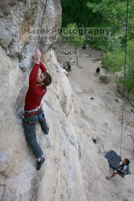 Me top rope climbing Diving for Rocks (5.10d) with Javier Morales belaying, photographed from  the third bolt of Magster (5.10a) by Andrew Dreher.  It was another long day of rock climbing at Seismic Wall on Austin's Barton Creek Greenbelt, Saturday, April 11, 2009.

Filename: SRM_20090411_17075319.JPG
Aperture: f/5.6
Shutter Speed: 1/320
Body: Canon EOS-1D Mark II
Lens: Canon EF 16-35mm f/2.8 L