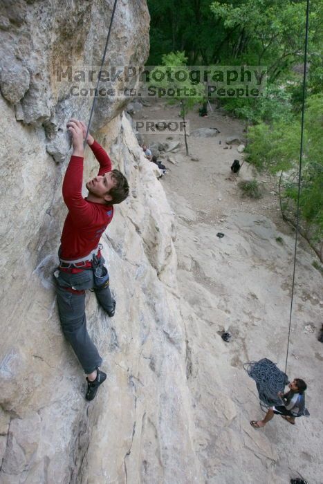 Me top rope climbing Diving for Rocks (5.10d) with Javier Morales belaying, photographed from  the third bolt of Magster (5.10a) by Andrew Dreher.  It was another long day of rock climbing at Seismic Wall on Austin's Barton Creek Greenbelt, Saturday, April 11, 2009.

Filename: SRM_20090411_17075421.JPG
Aperture: f/5.6
Shutter Speed: 1/320
Body: Canon EOS-1D Mark II
Lens: Canon EF 16-35mm f/2.8 L