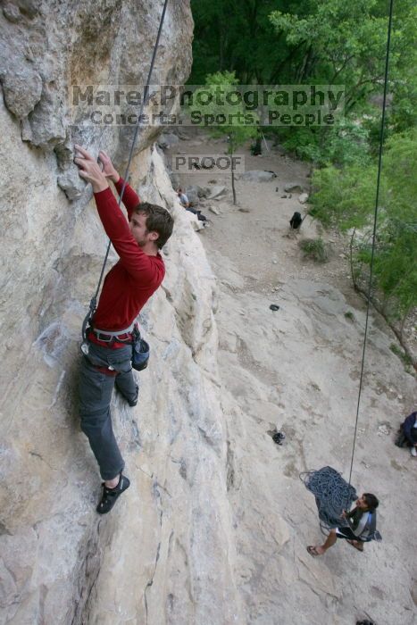 Me top rope climbing Diving for Rocks (5.10d) with Javier Morales belaying, photographed from  the third bolt of Magster (5.10a) by Andrew Dreher.  It was another long day of rock climbing at Seismic Wall on Austin's Barton Creek Greenbelt, Saturday, April 11, 2009.

Filename: SRM_20090411_17075722.JPG
Aperture: f/5.6
Shutter Speed: 1/320
Body: Canon EOS-1D Mark II
Lens: Canon EF 16-35mm f/2.8 L