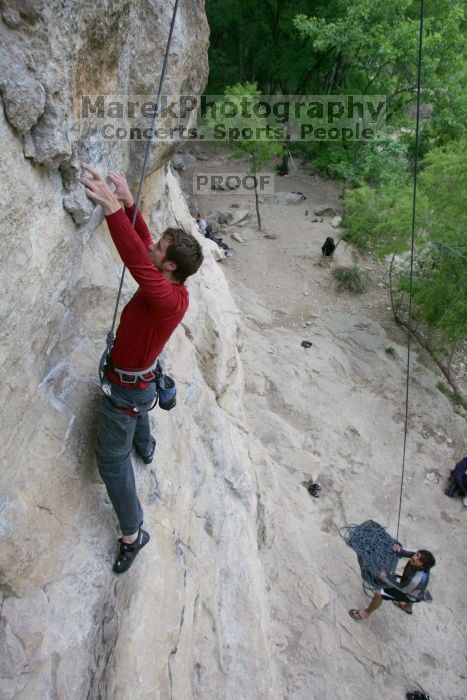 Me top rope climbing Diving for Rocks (5.10d) with Javier Morales belaying, photographed from  the third bolt of Magster (5.10a) by Andrew Dreher.  It was another long day of rock climbing at Seismic Wall on Austin's Barton Creek Greenbelt, Saturday, April 11, 2009.

Filename: SRM_20090411_17075923.JPG
Aperture: f/5.6
Shutter Speed: 1/320
Body: Canon EOS-1D Mark II
Lens: Canon EF 16-35mm f/2.8 L