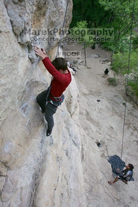 Me top rope climbing Diving for Rocks (5.10d) with Javier Morales belaying, photographed from  the third bolt of Magster (5.10a) by Andrew Dreher.  It was another long day of rock climbing at Seismic Wall on Austin's Barton Creek Greenbelt, Saturday, April 11, 2009.

Filename: SRM_20090411_17080524.JPG
Aperture: f/5.6
Shutter Speed: 1/320
Body: Canon EOS-1D Mark II
Lens: Canon EF 16-35mm f/2.8 L