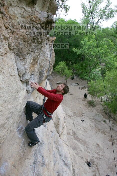 Me top rope climbing Diving for Rocks (5.10d), photographed from  the third bolt of Magster (5.10a) by Andrew Dreher.  It was another long day of rock climbing at Seismic Wall on Austin's Barton Creek Greenbelt, Saturday, April 11, 2009.

Filename: SRM_20090411_17080926.JPG
Aperture: f/5.6
Shutter Speed: 1/320
Body: Canon EOS-1D Mark II
Lens: Canon EF 16-35mm f/2.8 L