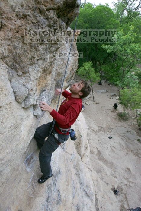 Me top rope climbing Diving for Rocks (5.10d), photographed from  the third bolt of Magster (5.10a) by Andrew Dreher.  It was another long day of rock climbing at Seismic Wall on Austin's Barton Creek Greenbelt, Saturday, April 11, 2009.

Filename: SRM_20090411_17081129.JPG
Aperture: f/5.6
Shutter Speed: 1/320
Body: Canon EOS-1D Mark II
Lens: Canon EF 16-35mm f/2.8 L