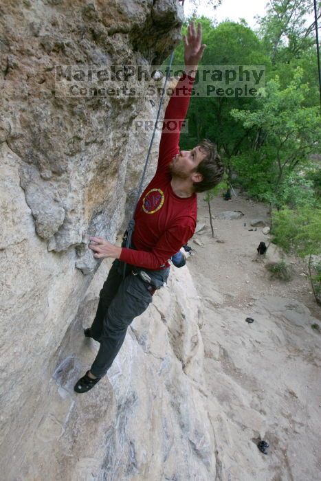 Me top rope climbing Diving for Rocks (5.10d), photographed from  the third bolt of Magster (5.10a) by Andrew Dreher.  It was another long day of rock climbing at Seismic Wall on Austin's Barton Creek Greenbelt, Saturday, April 11, 2009.

Filename: SRM_20090411_17081131.JPG
Aperture: f/5.6
Shutter Speed: 1/320
Body: Canon EOS-1D Mark II
Lens: Canon EF 16-35mm f/2.8 L