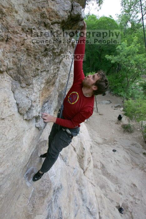 Me top rope climbing Diving for Rocks (5.10d), photographed from  the third bolt of Magster (5.10a) by Andrew Dreher.  It was another long day of rock climbing at Seismic Wall on Austin's Barton Creek Greenbelt, Saturday, April 11, 2009.

Filename: SRM_20090411_17081132.JPG
Aperture: f/5.6
Shutter Speed: 1/320
Body: Canon EOS-1D Mark II
Lens: Canon EF 16-35mm f/2.8 L