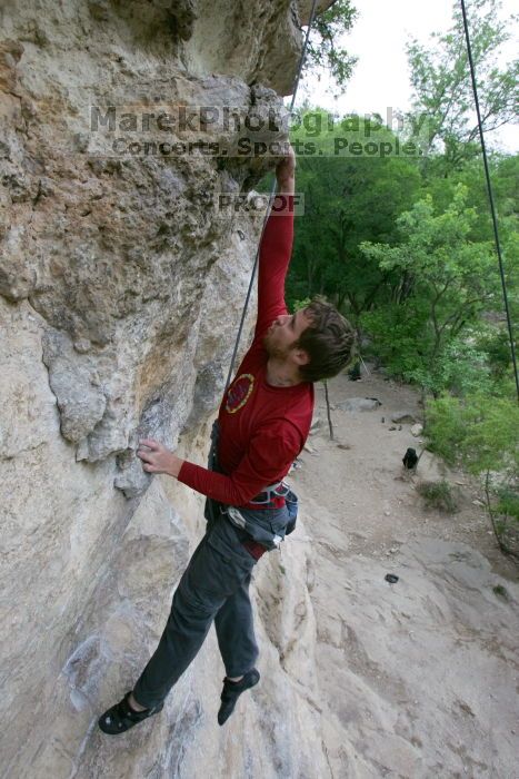 Me top rope climbing Diving for Rocks (5.10d), photographed from  the third bolt of Magster (5.10a) by Andrew Dreher.  It was another long day of rock climbing at Seismic Wall on Austin's Barton Creek Greenbelt, Saturday, April 11, 2009.

Filename: SRM_20090411_17081134.JPG
Aperture: f/5.6
Shutter Speed: 1/320
Body: Canon EOS-1D Mark II
Lens: Canon EF 16-35mm f/2.8 L