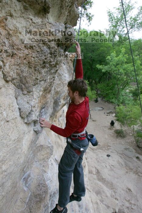 Me top rope climbing Diving for Rocks (5.10d), photographed from  the third bolt of Magster (5.10a) by Andrew Dreher.  It was another long day of rock climbing at Seismic Wall on Austin's Barton Creek Greenbelt, Saturday, April 11, 2009.

Filename: SRM_20090411_17081236.JPG
Aperture: f/5.6
Shutter Speed: 1/320
Body: Canon EOS-1D Mark II
Lens: Canon EF 16-35mm f/2.8 L