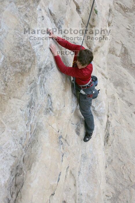 Me top rope climbing Diving for Rocks (5.10d), photographed from  the third bolt of Magster (5.10a) by Andrew Dreher.  It was another long day of rock climbing at Seismic Wall on Austin's Barton Creek Greenbelt, Saturday, April 11, 2009.

Filename: SRM_20090411_17092637.JPG
Aperture: f/5.6
Shutter Speed: 1/320
Body: Canon EOS-1D Mark II
Lens: Canon EF 16-35mm f/2.8 L