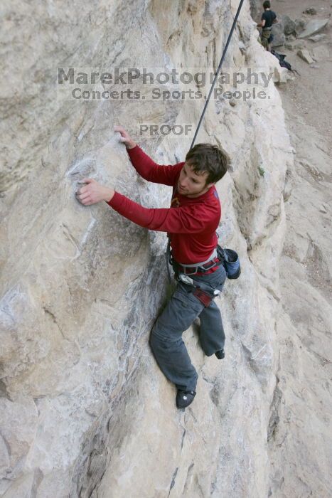 Me top rope climbing Diving for Rocks (5.10d), photographed from  the third bolt of Magster (5.10a) by Andrew Dreher.  It was another long day of rock climbing at Seismic Wall on Austin's Barton Creek Greenbelt, Saturday, April 11, 2009.

Filename: SRM_20090411_17095640.JPG
Aperture: f/5.6
Shutter Speed: 1/320
Body: Canon EOS-1D Mark II
Lens: Canon EF 16-35mm f/2.8 L